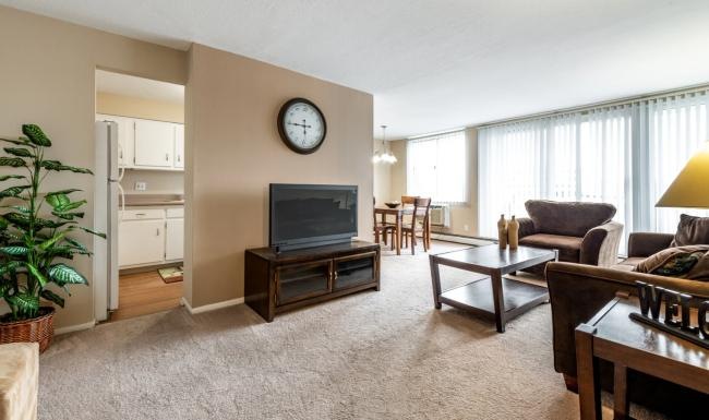 a living room with a tv and furniture