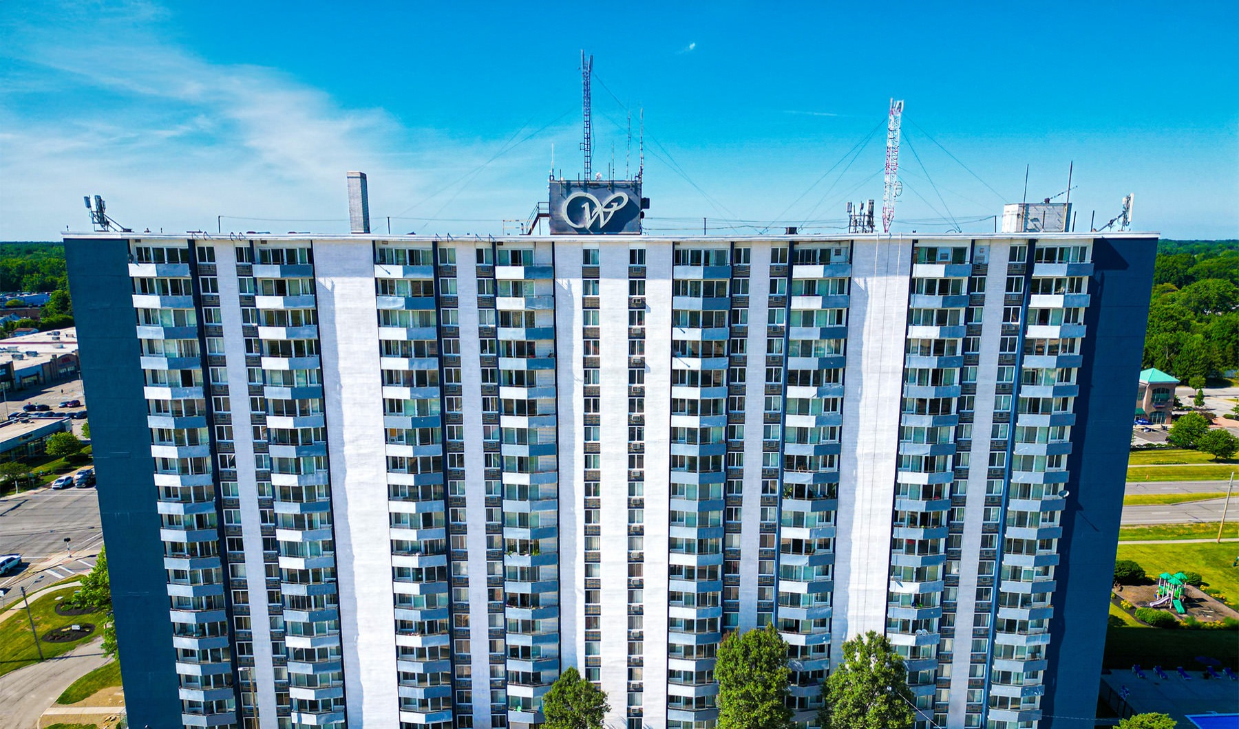 a tall building with a sign on top